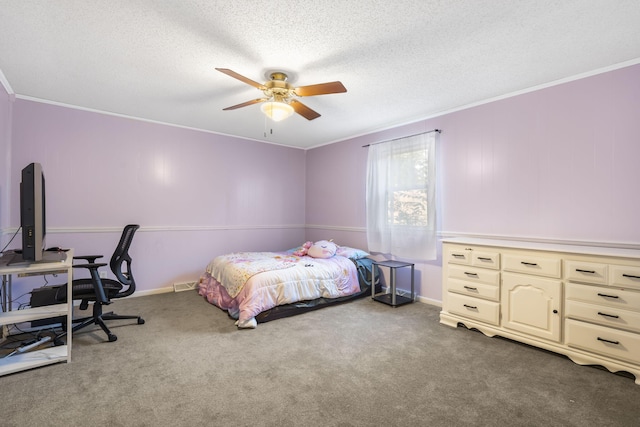 carpeted bedroom with ornamental molding, a textured ceiling, and ceiling fan