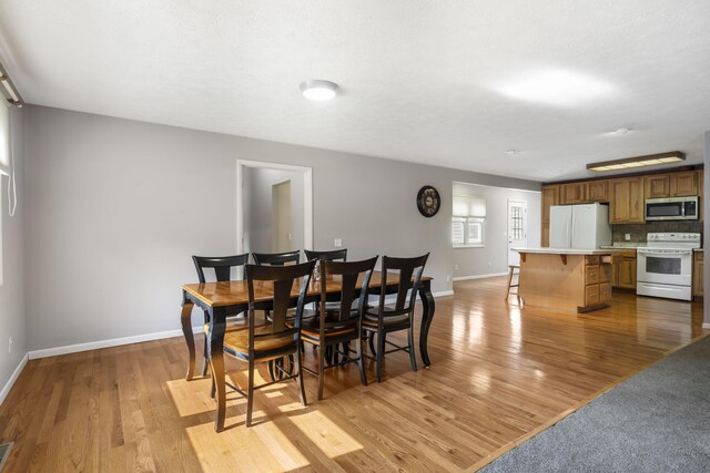 dining room featuring light hardwood / wood-style flooring