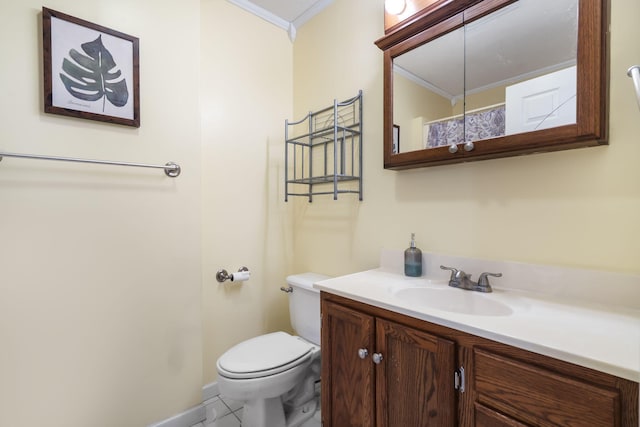 bathroom featuring ornamental molding, vanity, toilet, and tile patterned floors