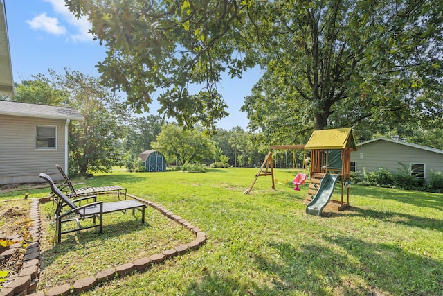 view of yard with a playground and a storage shed