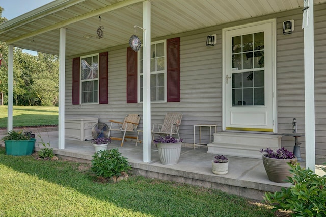 exterior space featuring a porch and a yard