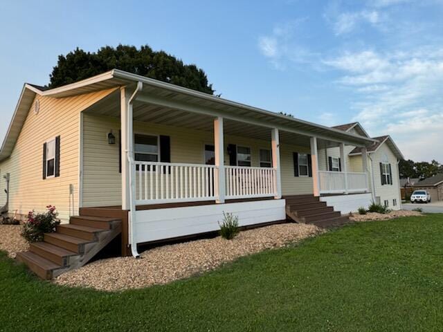 view of front of house featuring a front lawn and covered porch