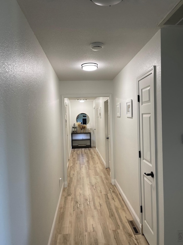 hallway featuring light hardwood / wood-style flooring