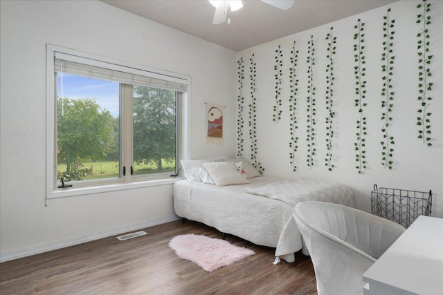 bedroom featuring wood-type flooring and ceiling fan