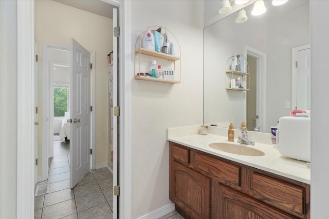 bathroom with tile patterned floors and vanity