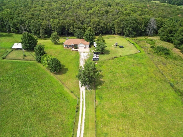 birds eye view of property with a rural view