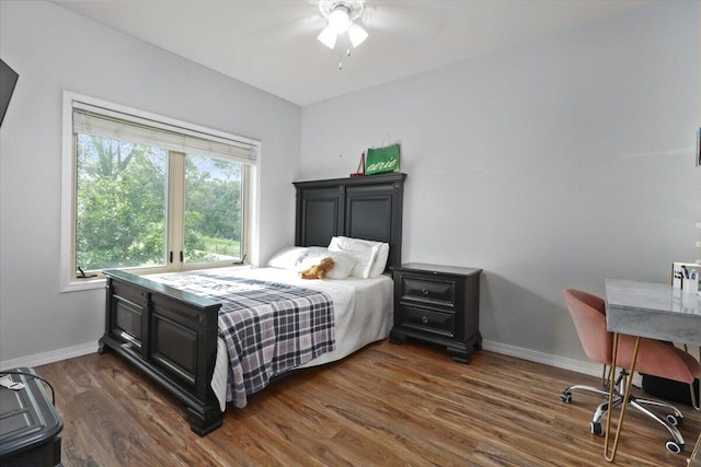 bedroom featuring ceiling fan and dark hardwood / wood-style flooring