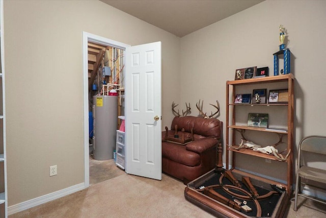 sitting room featuring light carpet and water heater