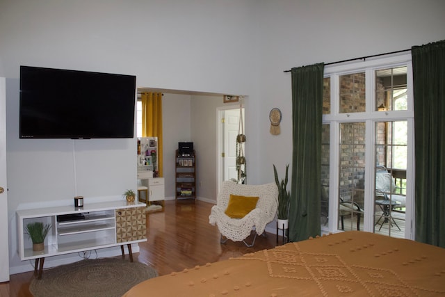 bedroom with wood finished floors and baseboards