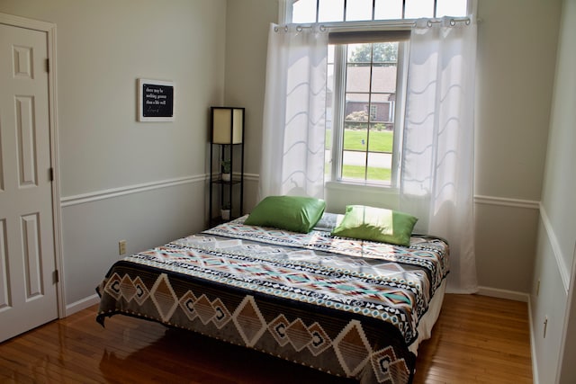 bedroom with hardwood / wood-style floors