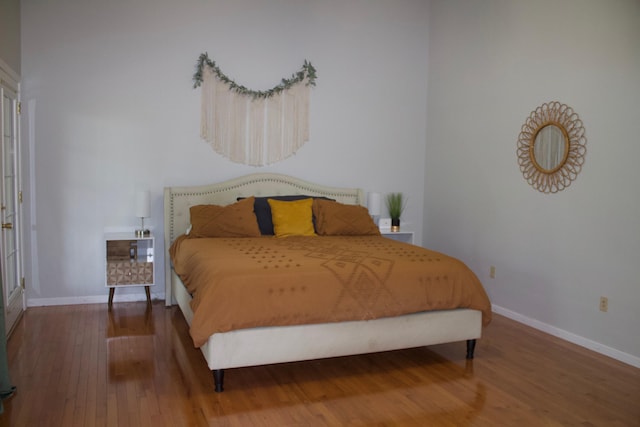 bedroom with wood-type flooring