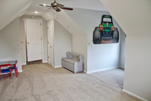 bonus room featuring ceiling fan, light colored carpet, and vaulted ceiling