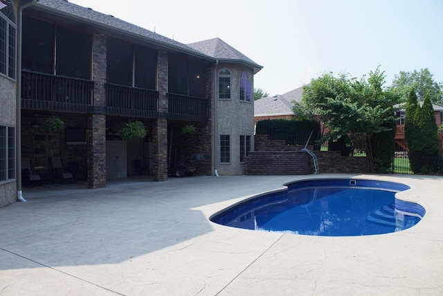 pool featuring a patio area
