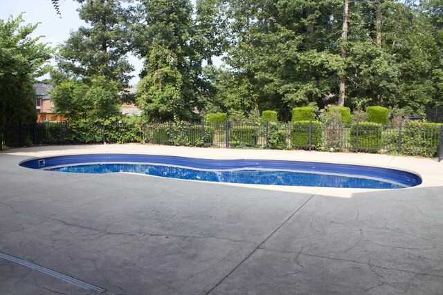 view of pool featuring fence, a patio, and a fenced in pool