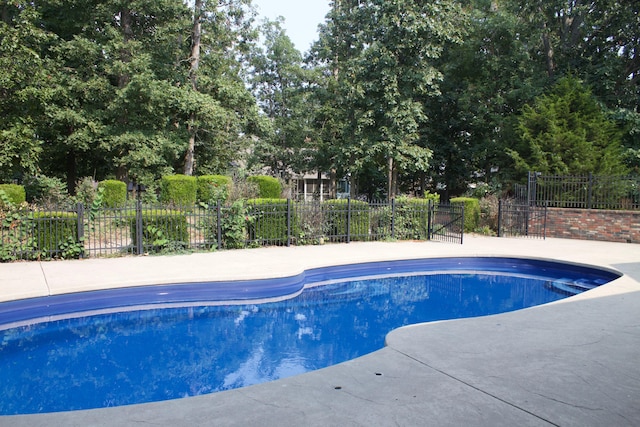 view of pool with fence and a fenced in pool