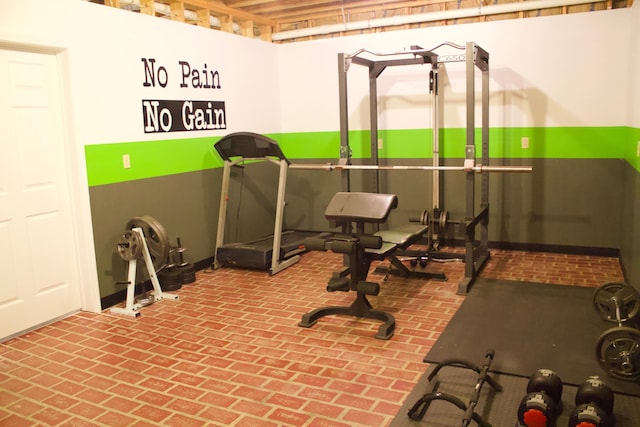 exercise area featuring brick floor