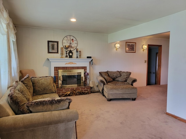 carpeted living room with a brick fireplace