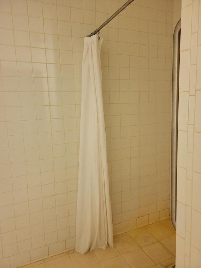 bathroom featuring a shower with curtain and tile patterned floors