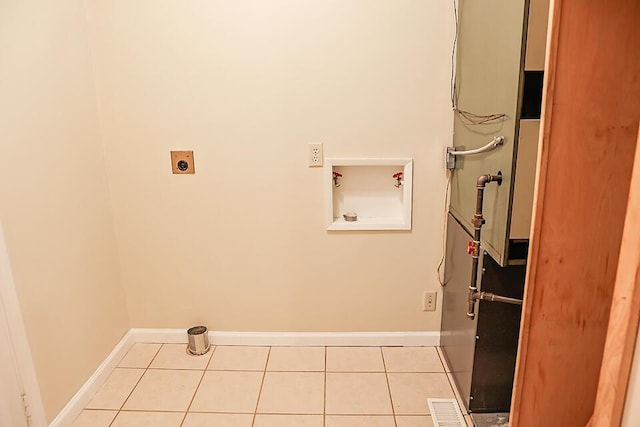 washroom featuring visible vents, hookup for a washing machine, electric dryer hookup, laundry area, and light tile patterned floors