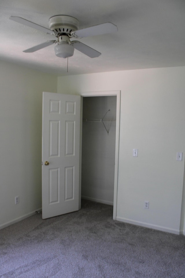 unfurnished bedroom featuring a closet, ceiling fan, and carpet floors