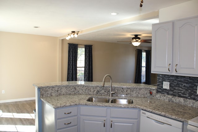 kitchen with white cabinetry, light hardwood / wood-style flooring, dishwasher, and sink