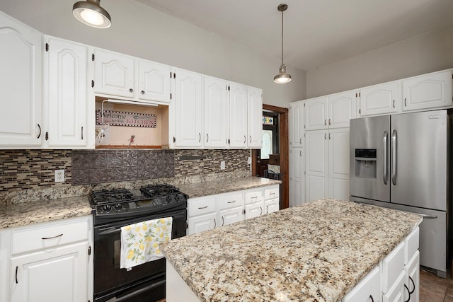 kitchen featuring a center island, stainless steel fridge with ice dispenser, white cabinets, and black gas range