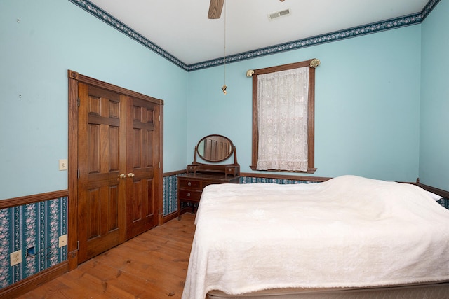 bedroom featuring ceiling fan and light hardwood / wood-style floors