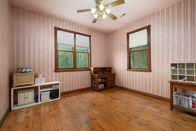 miscellaneous room with hardwood / wood-style flooring and ceiling fan