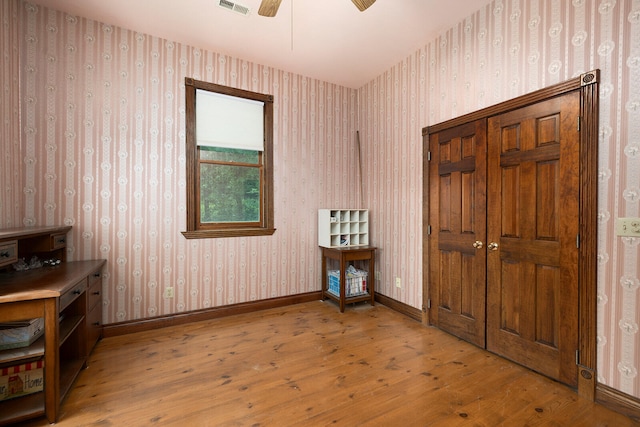 interior space with ceiling fan and light wood-type flooring