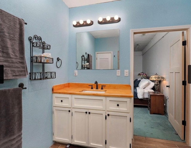 bathroom with vanity and wood-type flooring