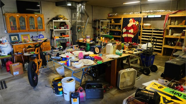 interior space with a workshop area and concrete floors