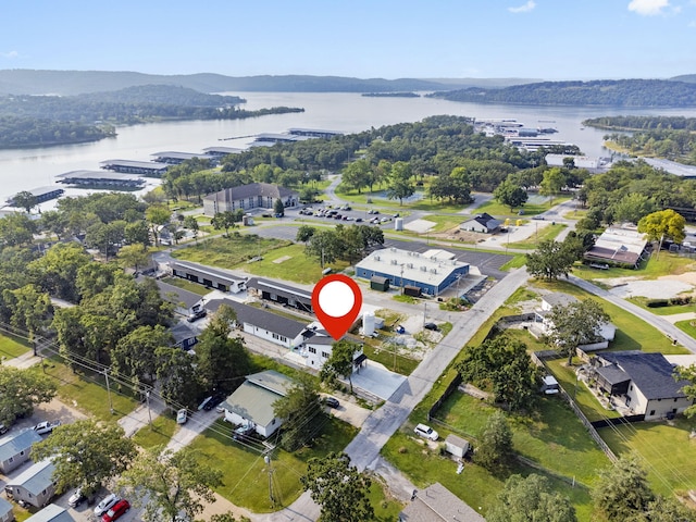 birds eye view of property featuring a water view and a residential view