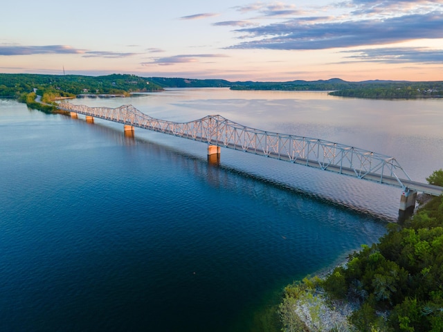 aerial view at dusk with a water view