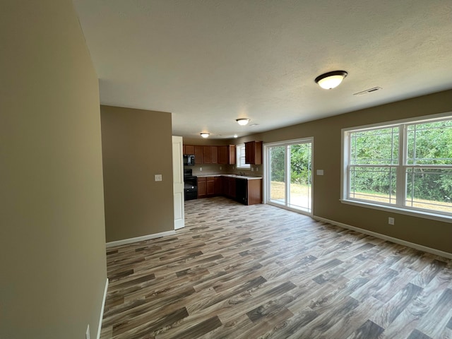 unfurnished living room featuring wood-type flooring