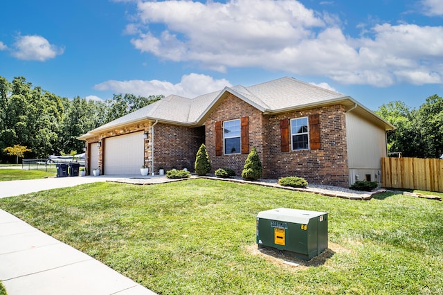 ranch-style house featuring a front lawn and a garage