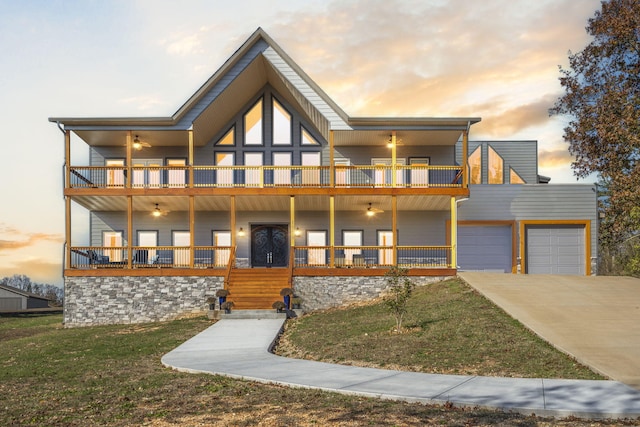 1379 Discovery Bay Dr, Shell Knob, MO 65747 - view of front of property with a balcony, a ceiling fan, and a front lawn