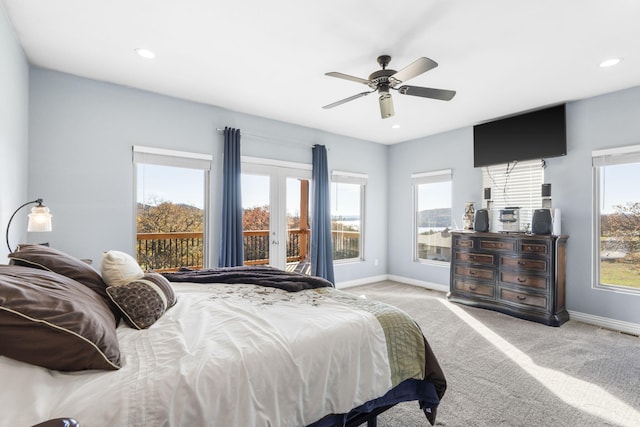 carpeted bedroom with access to outside, ceiling fan, and french doors