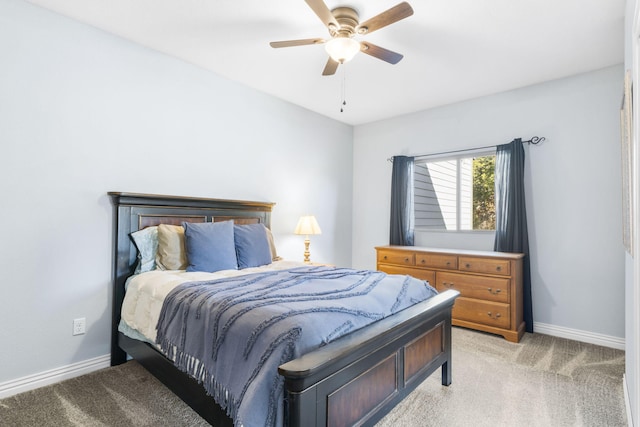 bedroom featuring light carpet and ceiling fan