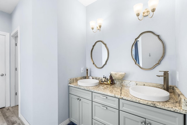 bathroom with hardwood / wood-style floors and vanity