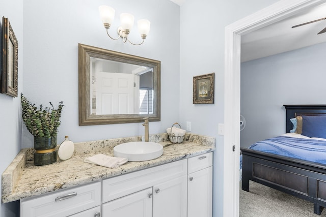 bathroom with ceiling fan and vanity