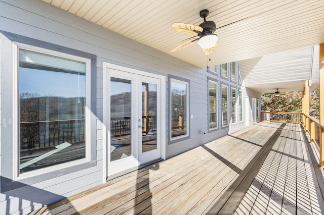 deck featuring ceiling fan and french doors