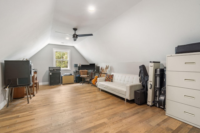 interior space with light wood-type flooring, ceiling fan, and vaulted ceiling