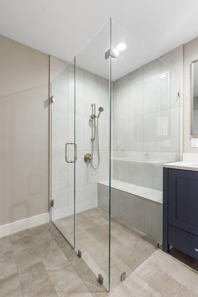 bathroom with an enclosed shower and vanity