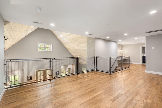 bonus room featuring light hardwood / wood-style flooring and lofted ceiling