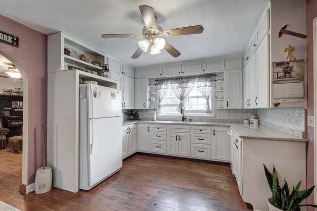 kitchen featuring white fridge, ceiling fan, white cabinets, and dark hardwood / wood-style flooring