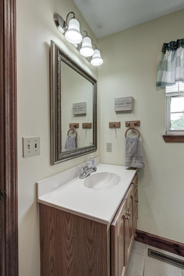 bathroom featuring tile patterned floors and vanity