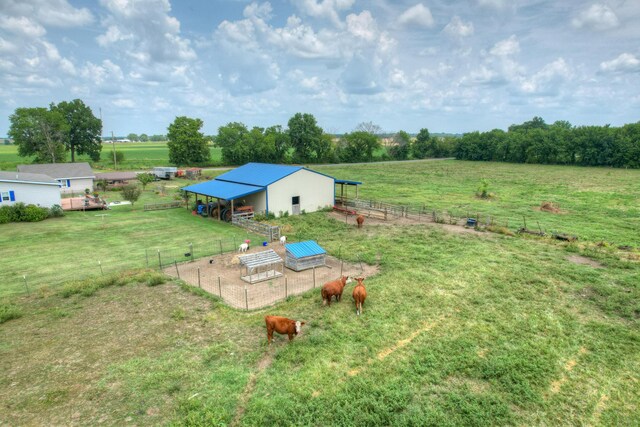 birds eye view of property featuring a rural view