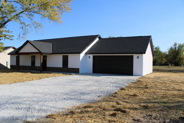 410 Park St, Taneyville, MO 65759 - modern farmhouse featuring a garage and roof with shingles