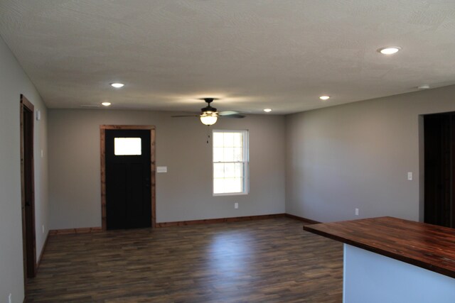 410 Park St, Taneyville, MO 65759 - unfurnished living room featuring dark wood finished floors, baseboards, recessed lighting, and ceiling fan