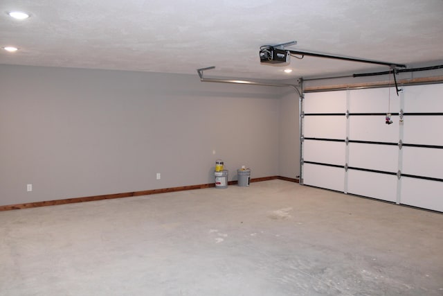 410 Park St, Taneyville, MO 65759 - garage with a garage door opener, recessed lighting, and baseboards
